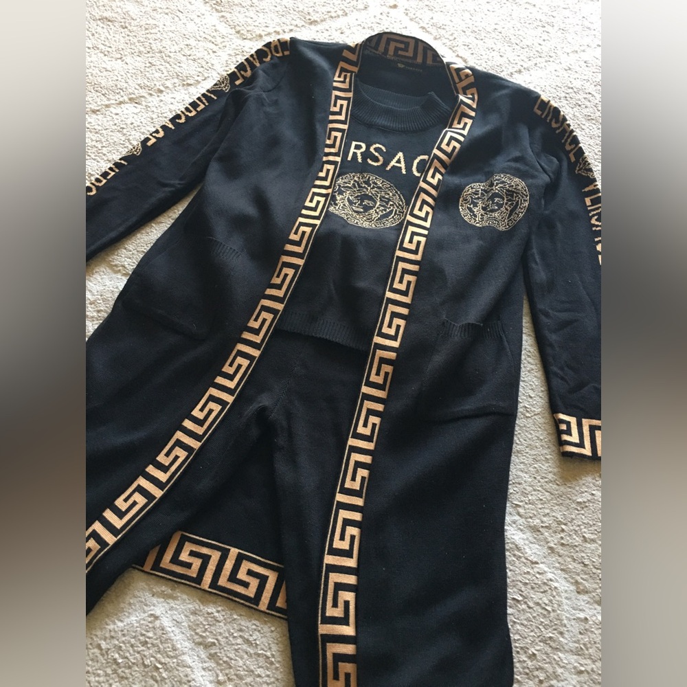 Three piece women’s Versace set. Long cardigan, crop top, and joggers.